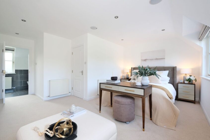 Spacious minimalist bedroom with the Inverurie property.