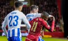 Aberdeen striker Duk caught on the side of the head by Georgios Kanellopoulos of HJK Helsinki's right elbow while challenging for the ball. Image: Shutterstock.