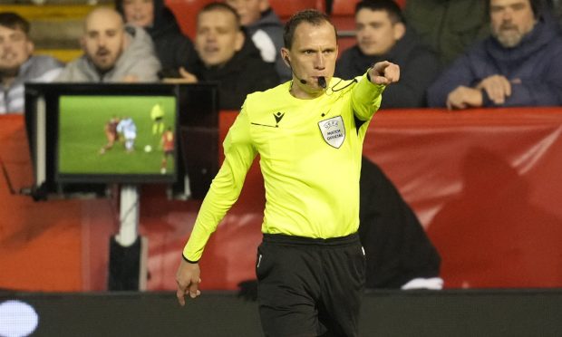 Referee Sebastian Gishamer awards a penalty kick to PAOK in time added after checking footage on the VAR screen. Stefan Schwab of PAOK scored the spot-kick with the last kick of the ball to give PAOK a 3-2 victory against Aberdeen. Image: Shutterstock.