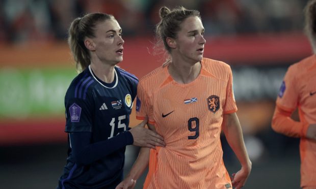 Scotland's Jenna Clark comes up against the Netherlands' Vivianne Miedema in a Uefa Nations League match.