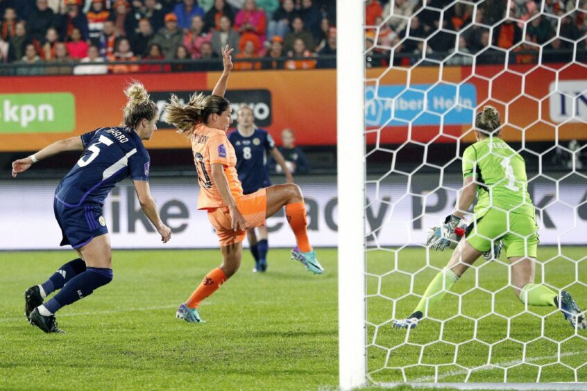 Danielle van de Donk gets to the ball first to put Netherlands in front against Scotland Women. Image: Hollandse Hoogte/Shutterstock (14170186f)