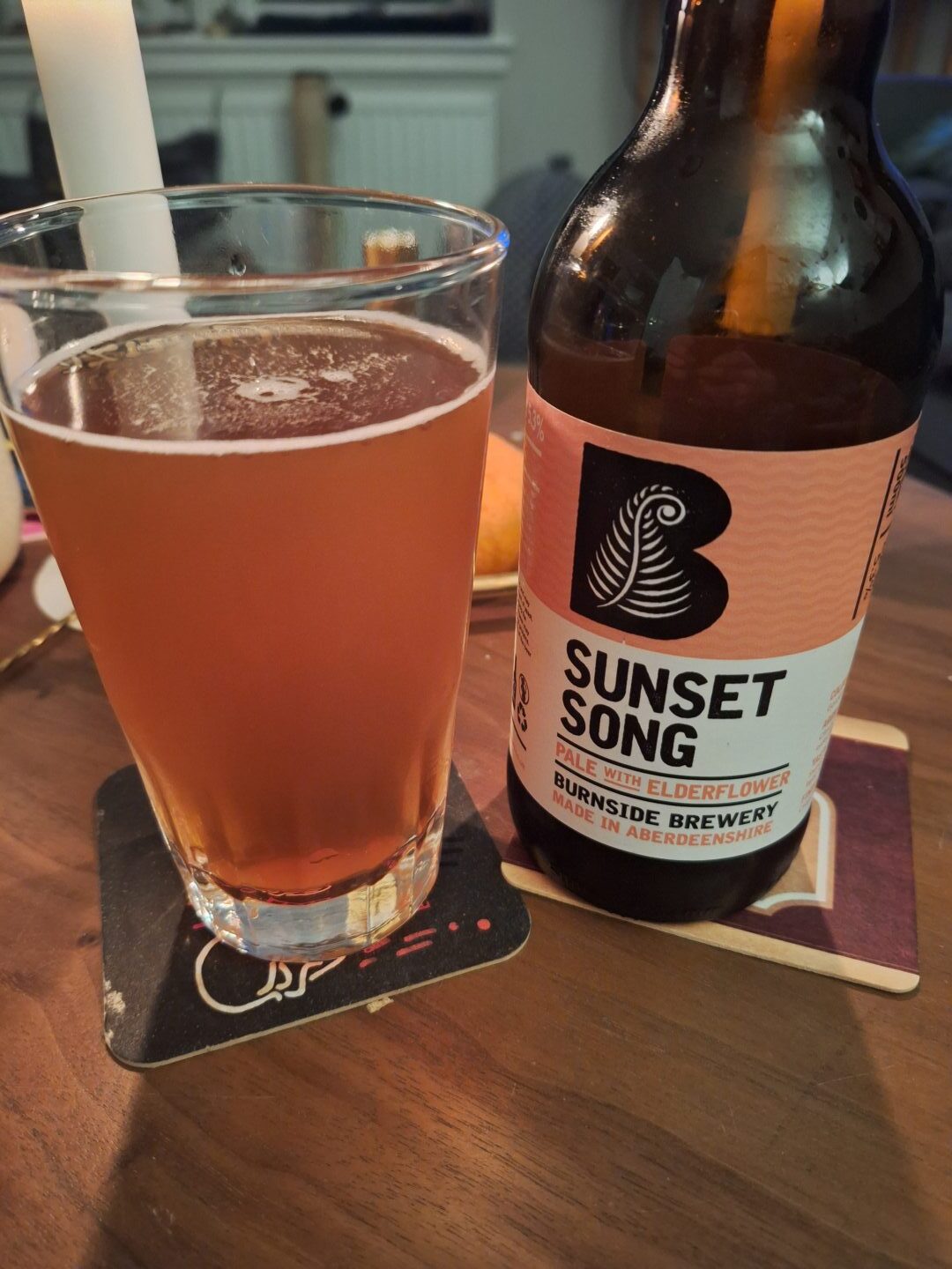 A bottle of Sunset Song from Burnside Brewery poured into a glass