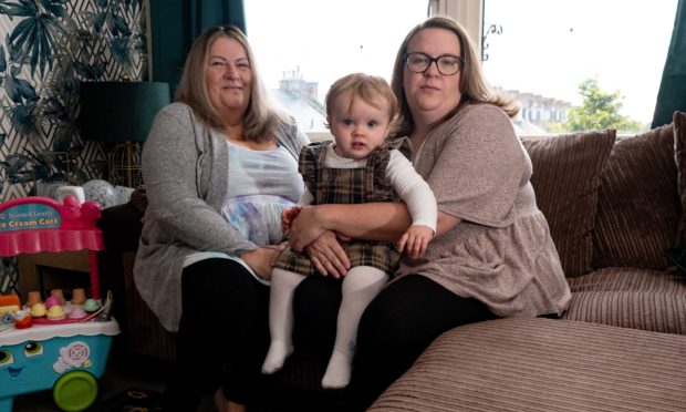 June Soutar (left) is sleeping on her daughter Kerry's sofa after evacuating her flat in Brechin with her granddaughter Ruby. Image: Paul Reid