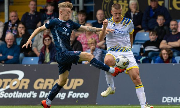 Ross County's Kyle Turner (left) and St Johnstone's Sam McClelland. Image: Mark Scates/SNS Group.