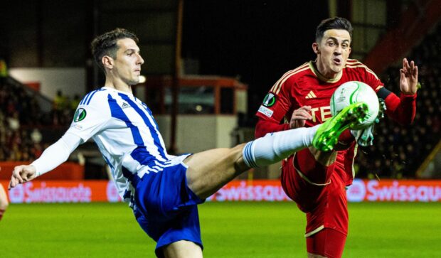 Helsinki's Georgios Kanellopoulos and Aberdeen's Jamie McGrath in action under the lights at Pittodrie. Image: SNS.