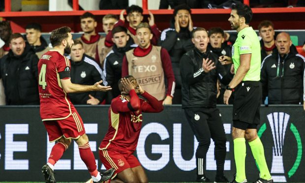 Aberdeen's Luis Lopes looks dejectedly at the referee during the match against HJK Helsinki at Pittodrie. Image: SNS.