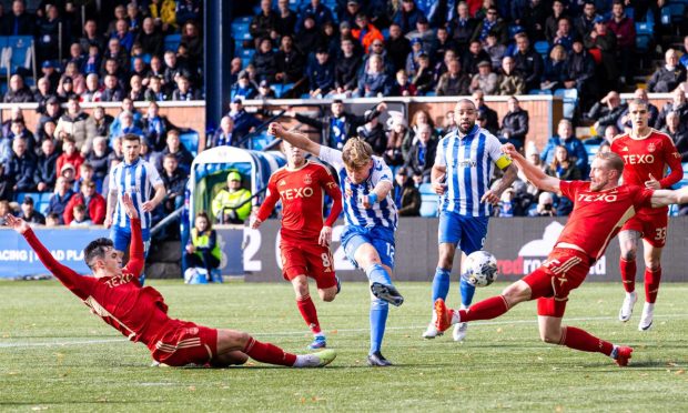 Kilmarnock's David Watson has a shot blocked by Aberdeen's Richard Jensen. Image: SNS