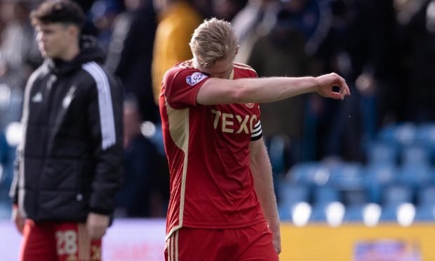 Aberdeen's Richard Jensen looks dejected after losing 2-0 at Kilmarnock. Image: SNS.