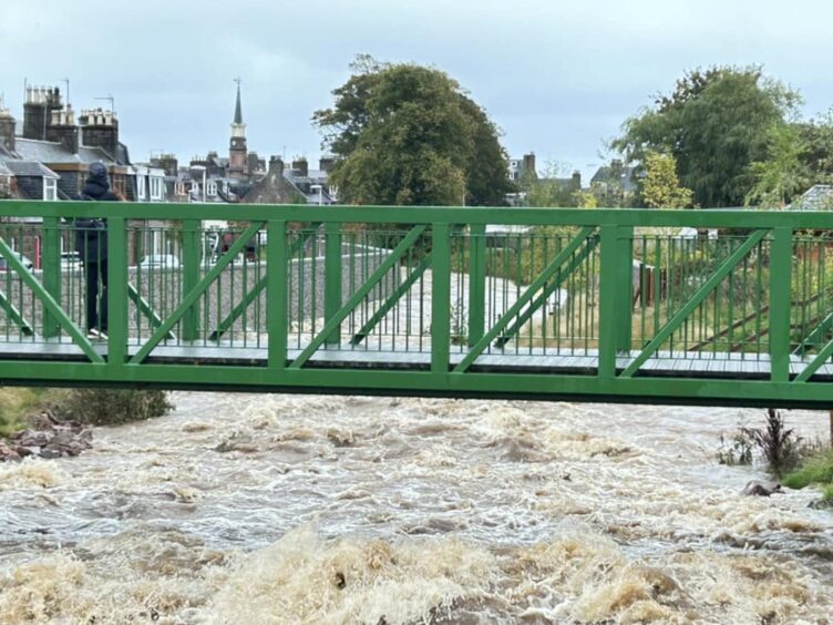 Carron water rises up as floodwater thunders through Stonehaven, Aberdeenshire.