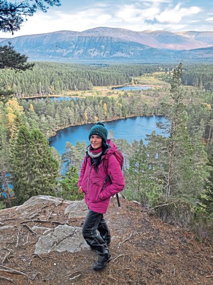 Gayle with Uath lochans behind her during her rewilding journey in the cairngorms
