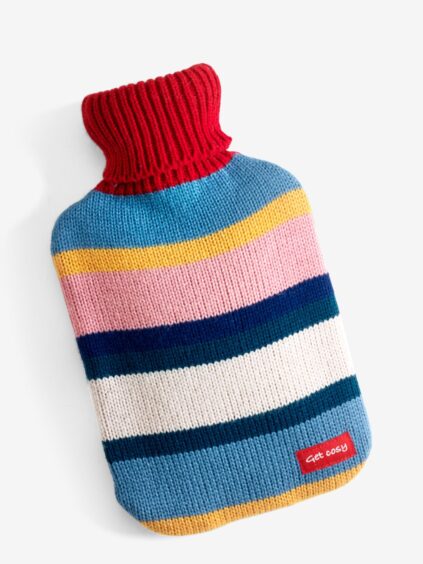 Colourful knitted hot water bottle to keep you cosy this fall.
