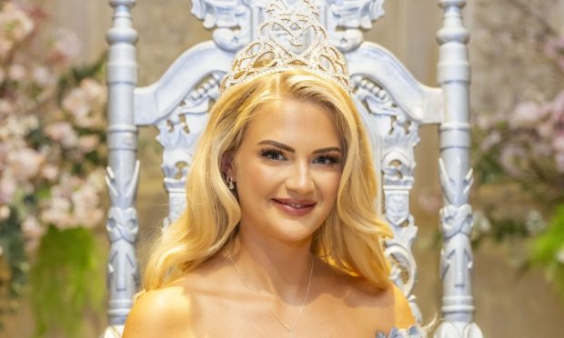 Chelsie Allison beaming as the Miss Scotland crown sits on her blonde hair.