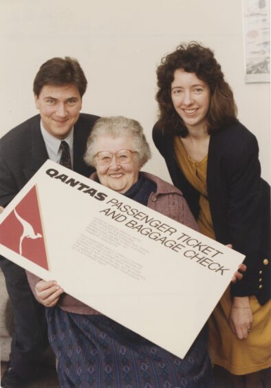 Scott McLean, left, and Susan MacKay, right, present Daisy Smith, centre, with her prize. Source: The British Newspaper Archive.