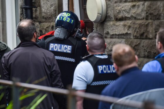A drug raid being carried out in Aberdeen.