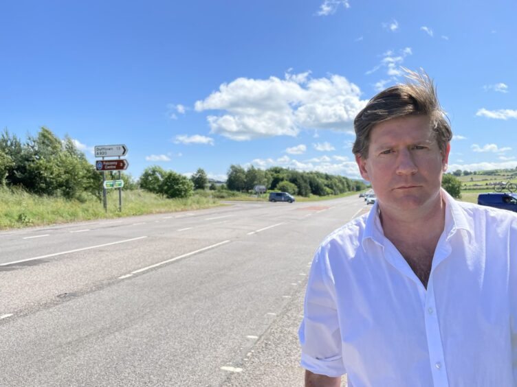 Pictures is Alexander Burnett, the MSP for Aberdeenshire West, on the A96.