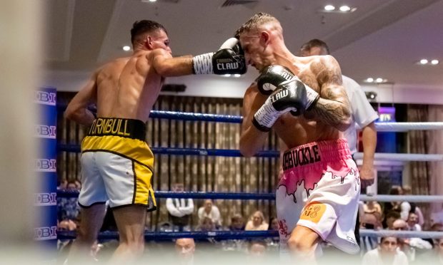 A clean connection here for Inverness boxer Calum Turnbull, but it was a 96-95 defeat against Dylan Arbuckle in the Scottish Super Bantamweight title showdown at the Drumossie Hotel. Images: Jasperimage