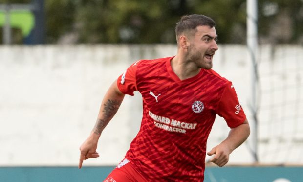 2 August 2023. Dudgeon Park, Seaforth Place, Brora, KW9 6PL. This is from the Scottish Challenge Cup match between Brora Rangers FC and Aberdeen B FC. PICTURE CONTENT:- Brora - Jordan Macrae celebrates