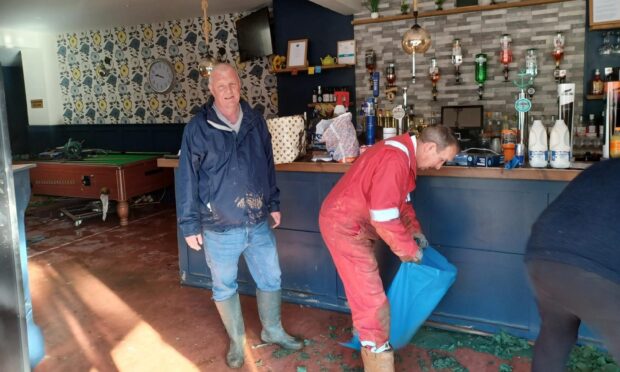 In picture: Scott McNeil of the Bridgend Bar in Brechin during the clean-up. Image: Chris Ferguson/DC Thomson