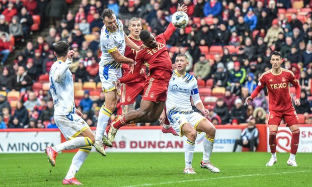 St Johnstone's Andy Considine heads into his own net against Aberdeen - a goal eventually ruled out for offside. Image: Darrell Benns/DC Thomson.