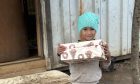 boy in Kosovo receives a shoebox from Blythswood Care's shoebox appeal