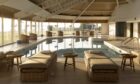 Coast Spa's pool offers stunning views of the coast with floor to ceiling windows