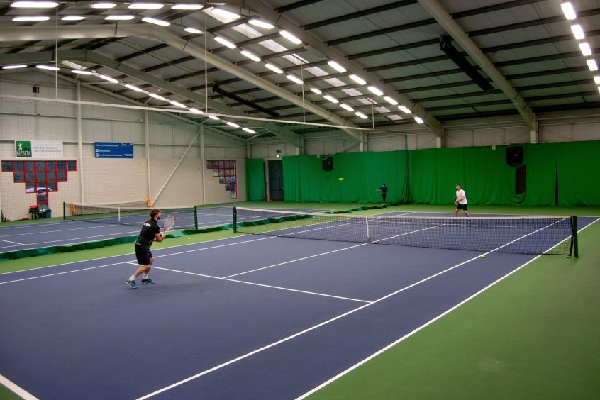 two men get active in Aberdeen, playing tennis at the Aberdeen Tennis Centre