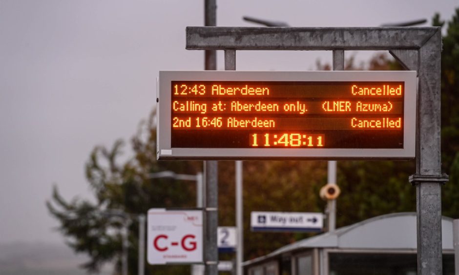 View of train departure board showing trains cancelled to Aberdeen.