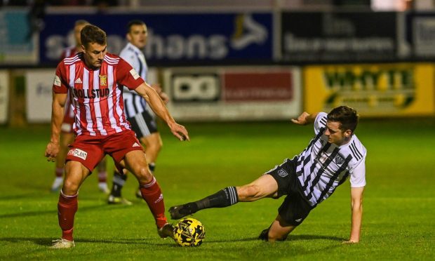 Formartine United's Scott Lisle, left, and Sean Butcher of Fraserburgh battle for the ball. Pictures by Darrell Benns/DCT Media