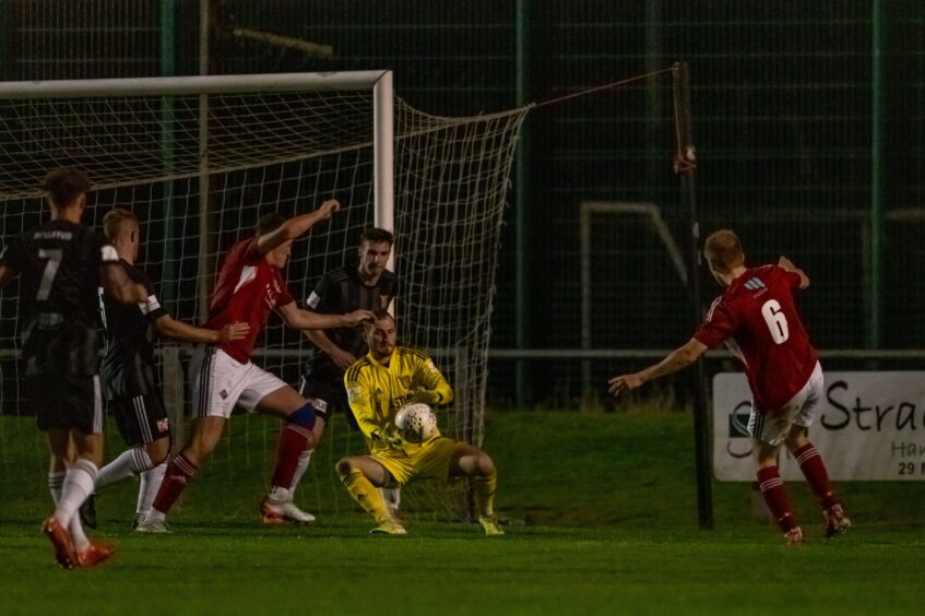 Formartine goalkeeper Ewen Macdonald catching the ball in front of the goal
