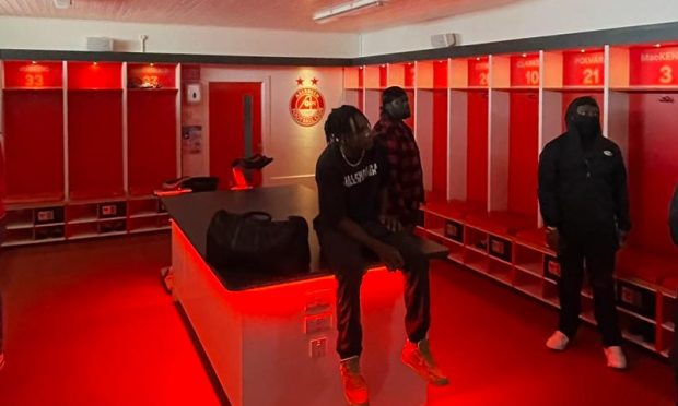 Aberdeen rappers Yxng Stunna and M2 in the Pittodrie home dressing room during the filming of the video for DUUUK. Image supplied by Cold Grey Music