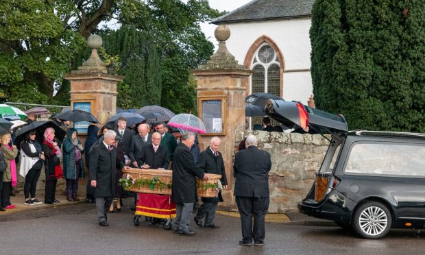 Kirsteen Maclennan's coffin being taken to the hearse.