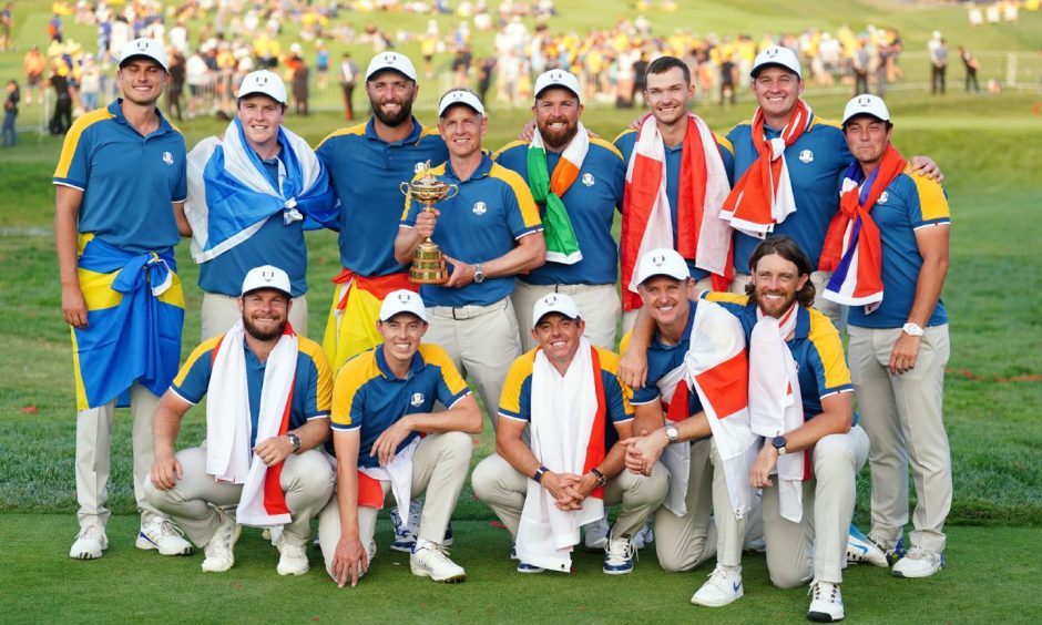 Team Europe captain Luke Donald and players hold the Ryder Cup Trophy