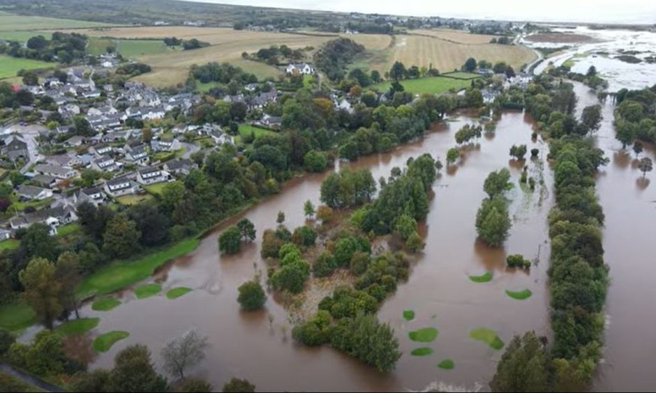 Drone photo showing water covering Garmouth golf course and village.