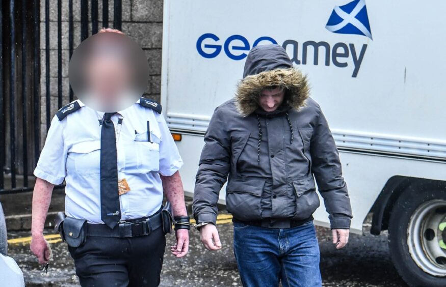 Aberdeen paedophile Greig Dow being escorted by police.