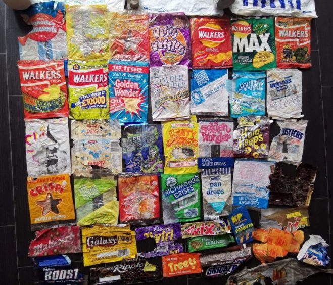Old crisp packets lined up.