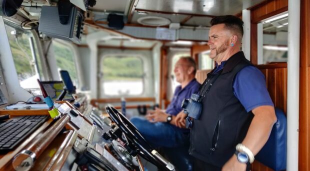 The captain of the Gemini Explorer and Chef Ian on the bridge. Picture: Felicity Donohoe