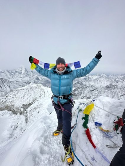 Davie celebrates reaching the top of Island Peak