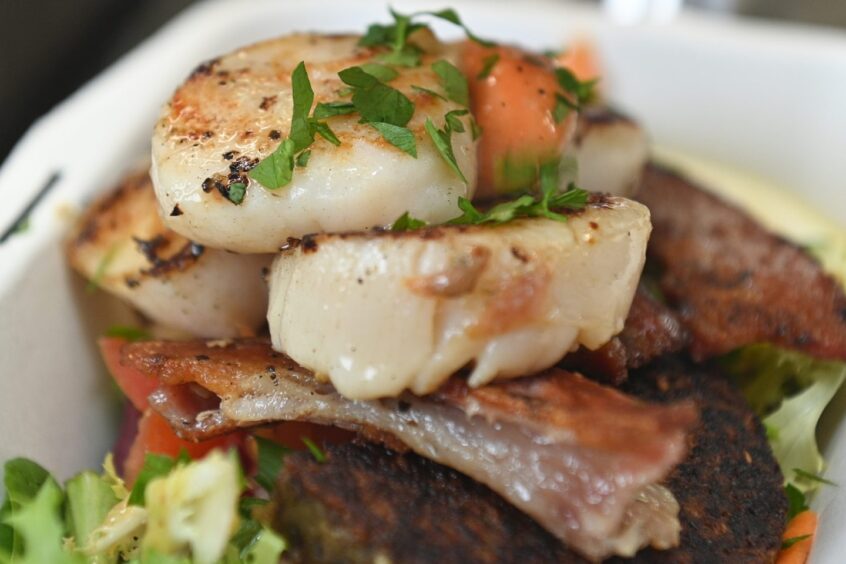 A plate of Uist king scallops with Cockburn haggis and a smoked bacon salad from The Redshank