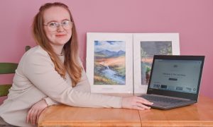 Holly Lazenby of Lazy bean, with her laptop