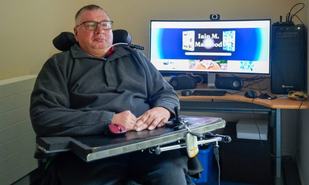 Iain M Stephen in his home in Elgin where he has broadband issues