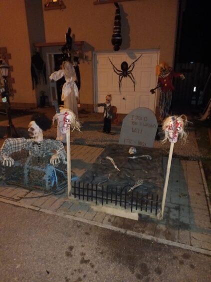 Halloween ghosts, including one in a grave, outside Aberdeenshire home.