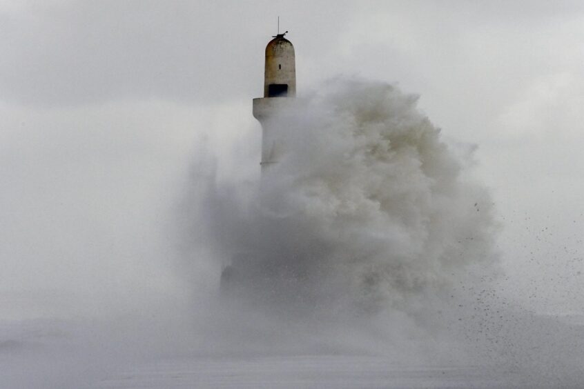 Waves striking Aberdeen Harbour. 