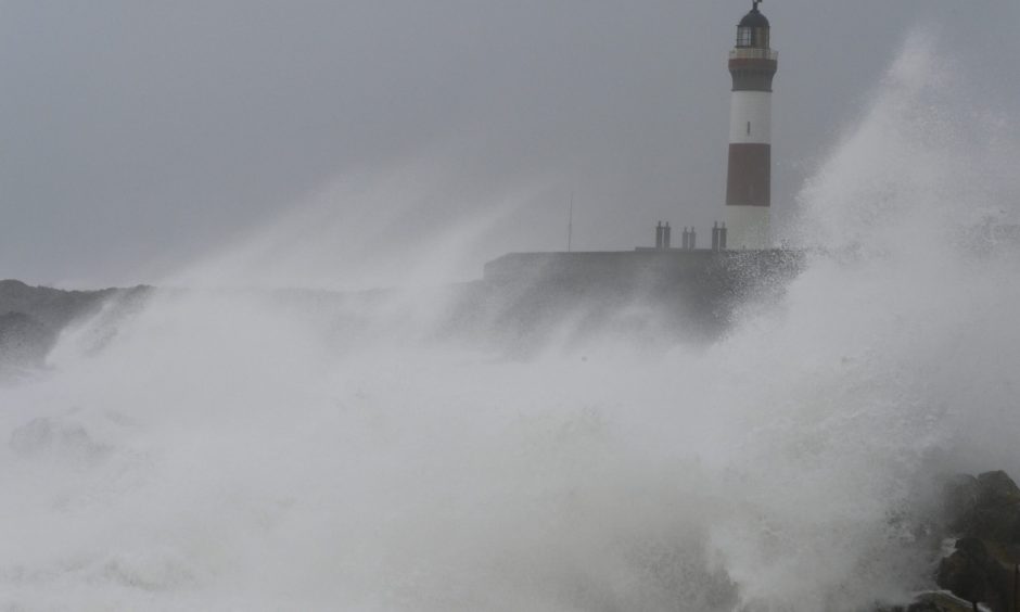 Storm Babet waves crashing at Boddam Harbour. Image: Kenny Elrick/DC Thomson.