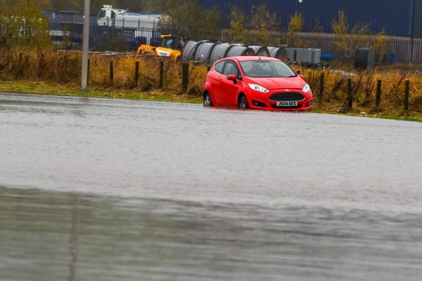 Car in floods.