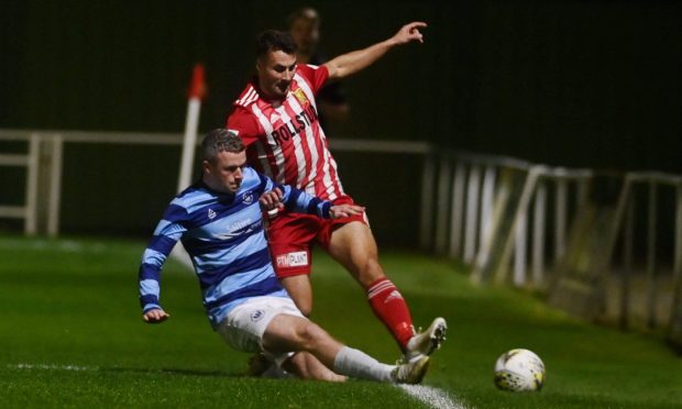 Banks o' Dee's Mark Gilmour, left, tackles Scott Lisle of Formartine United. Pictures by Kenny Elrick/DC Thomson.