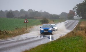 Cars driving through surface water