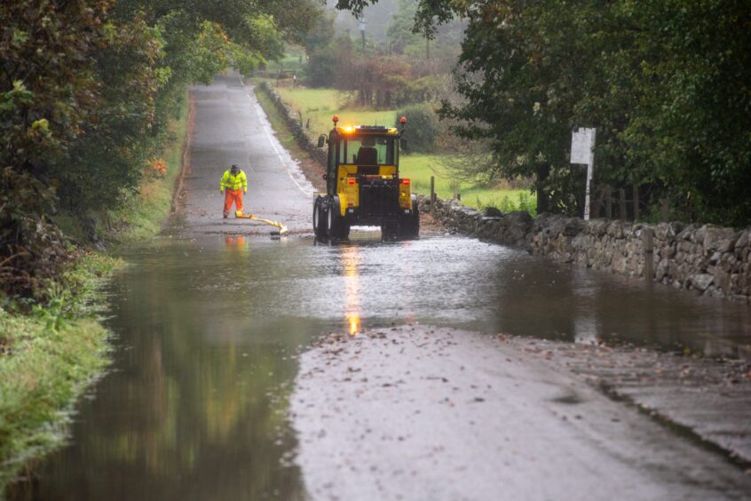 Flooding fills Countesswells Road in Aberdeen.