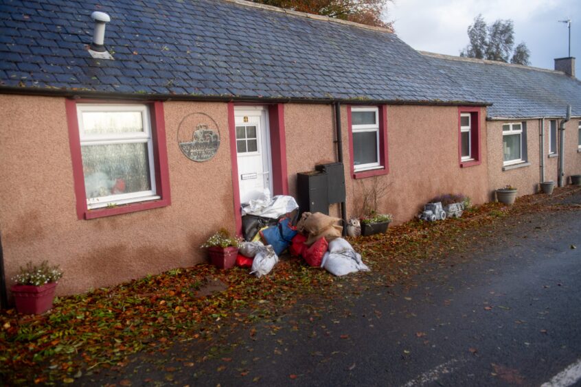 Sandbags sit outside Marykirk home to halt flooding.