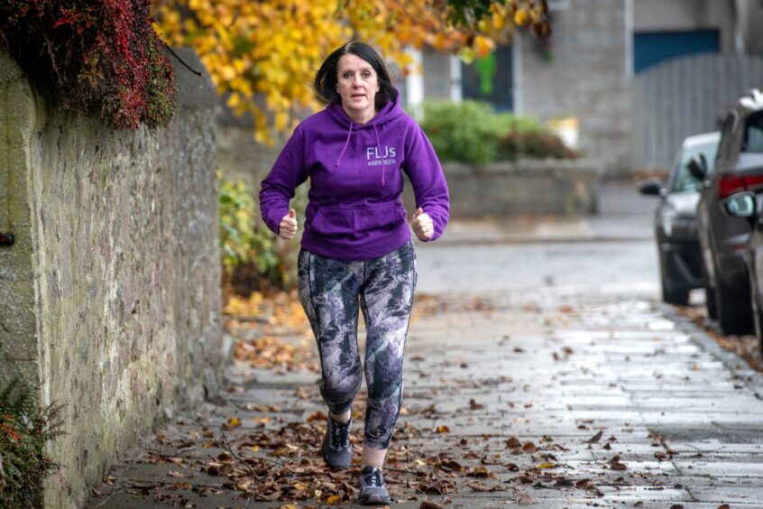 Linda on a run in Aberdeen while wearing a Fit Like Joggers hoodie.