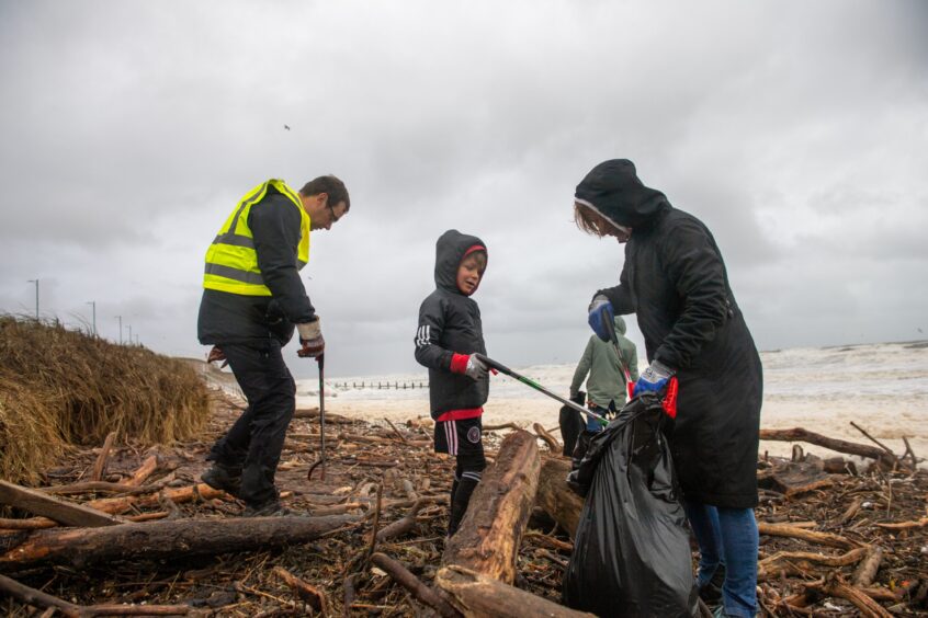 Volunteers picking up litter.